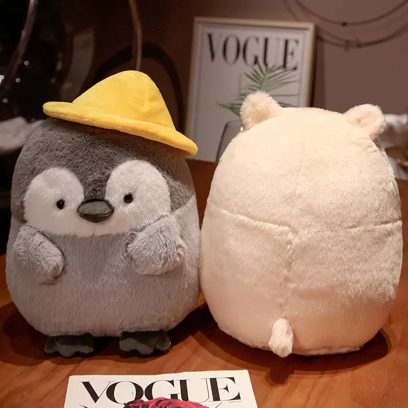 帽子をかぶったかわいいペンギンのぬいぐるみ メロンの種を持った子供たちへのクリスマスプレゼント Dookilive