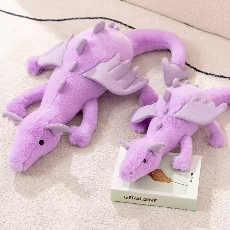 a pair of purple plush dolls