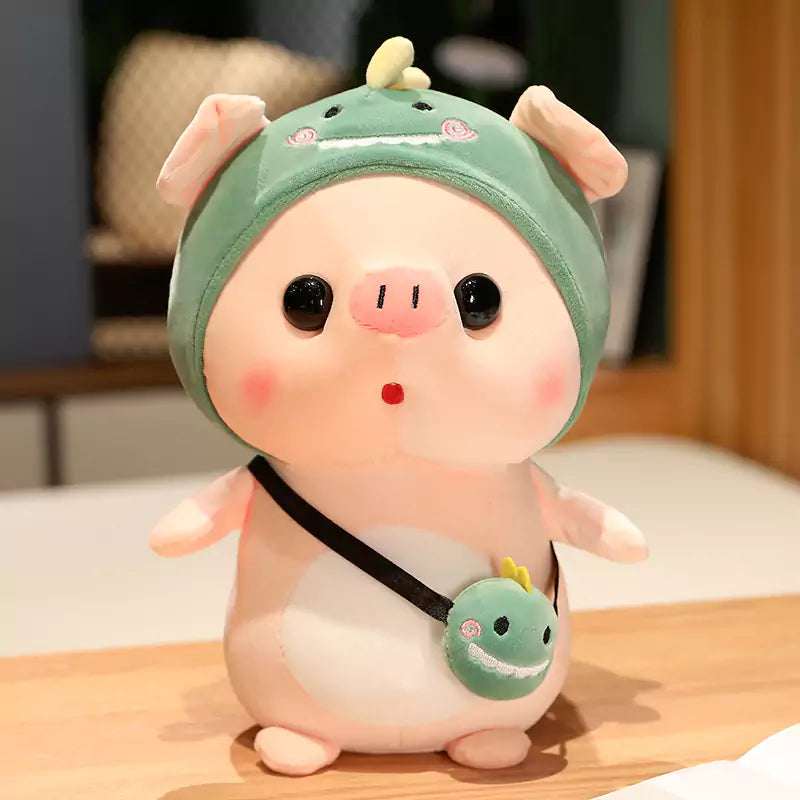pig stuffed animals wearing dinosaur suits