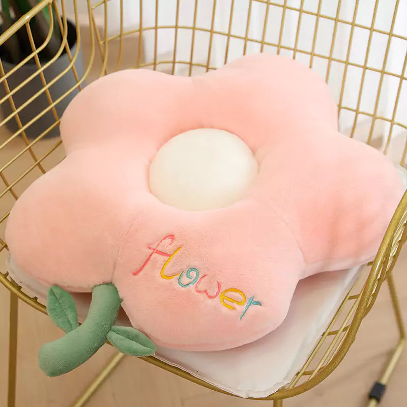 pink flower cushion on the chair