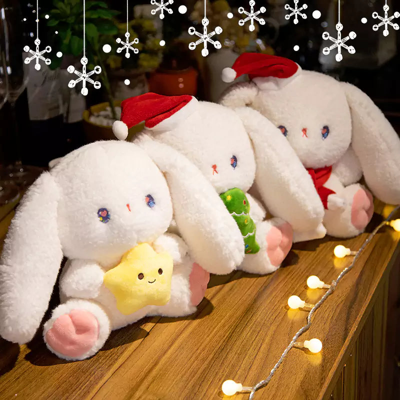 three rabbit dolls sitting together