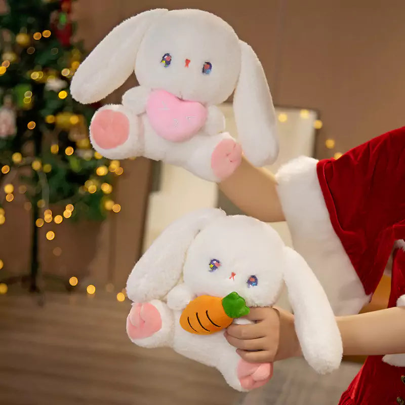 two rabbit dolls in hand