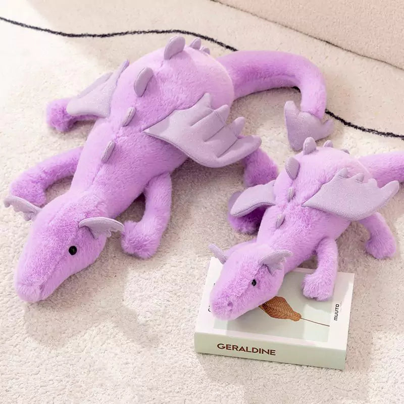    a pair of purple plush dolls