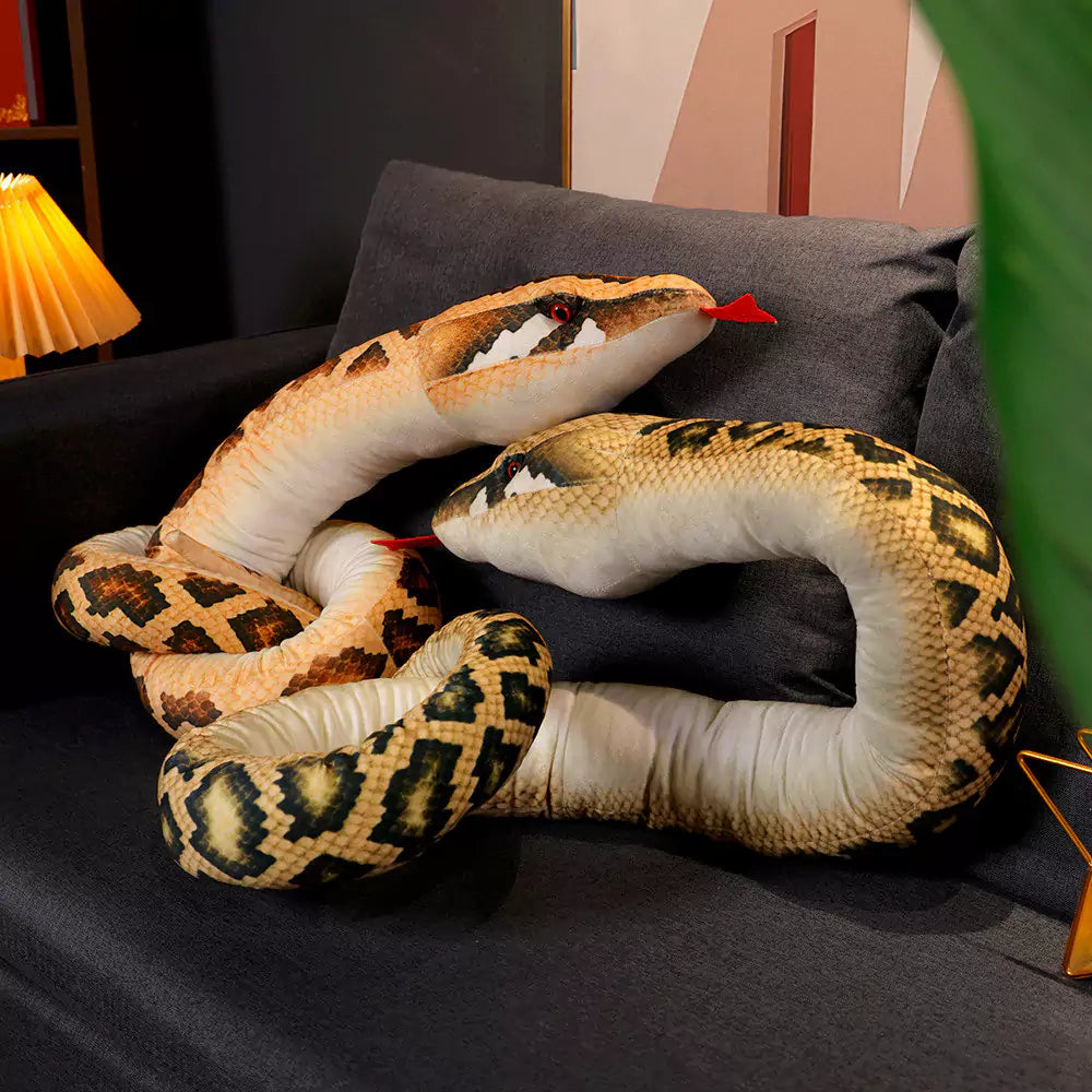 anaconda stuffed animals on the sofa