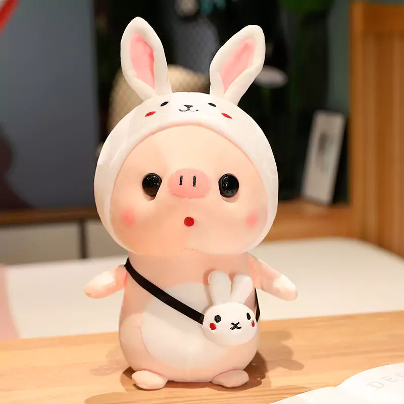 pig stuffed animals wearing rabbit suits