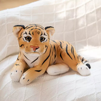 plush filled tiger lying on its side