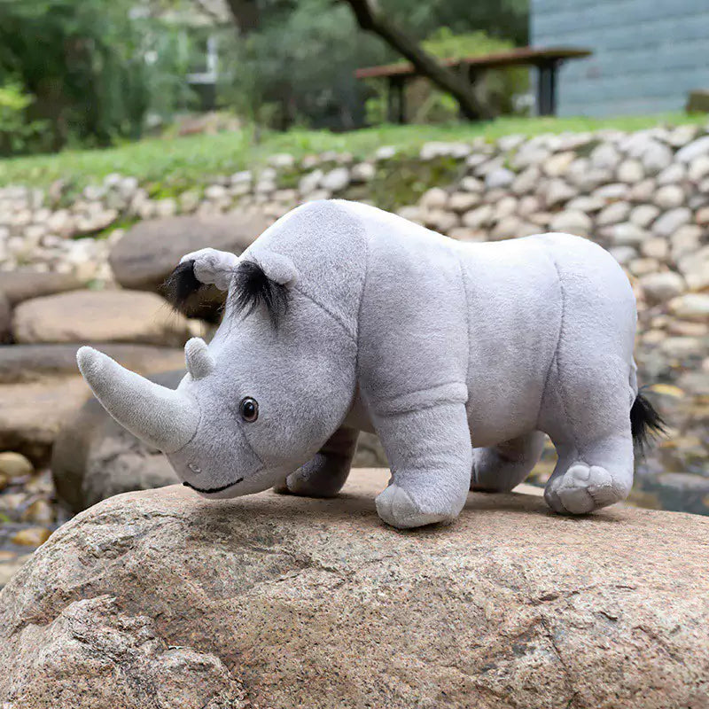 rhinoceros standing on stone