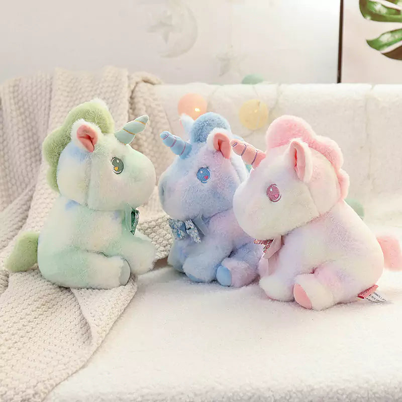 three unicorns sitting together